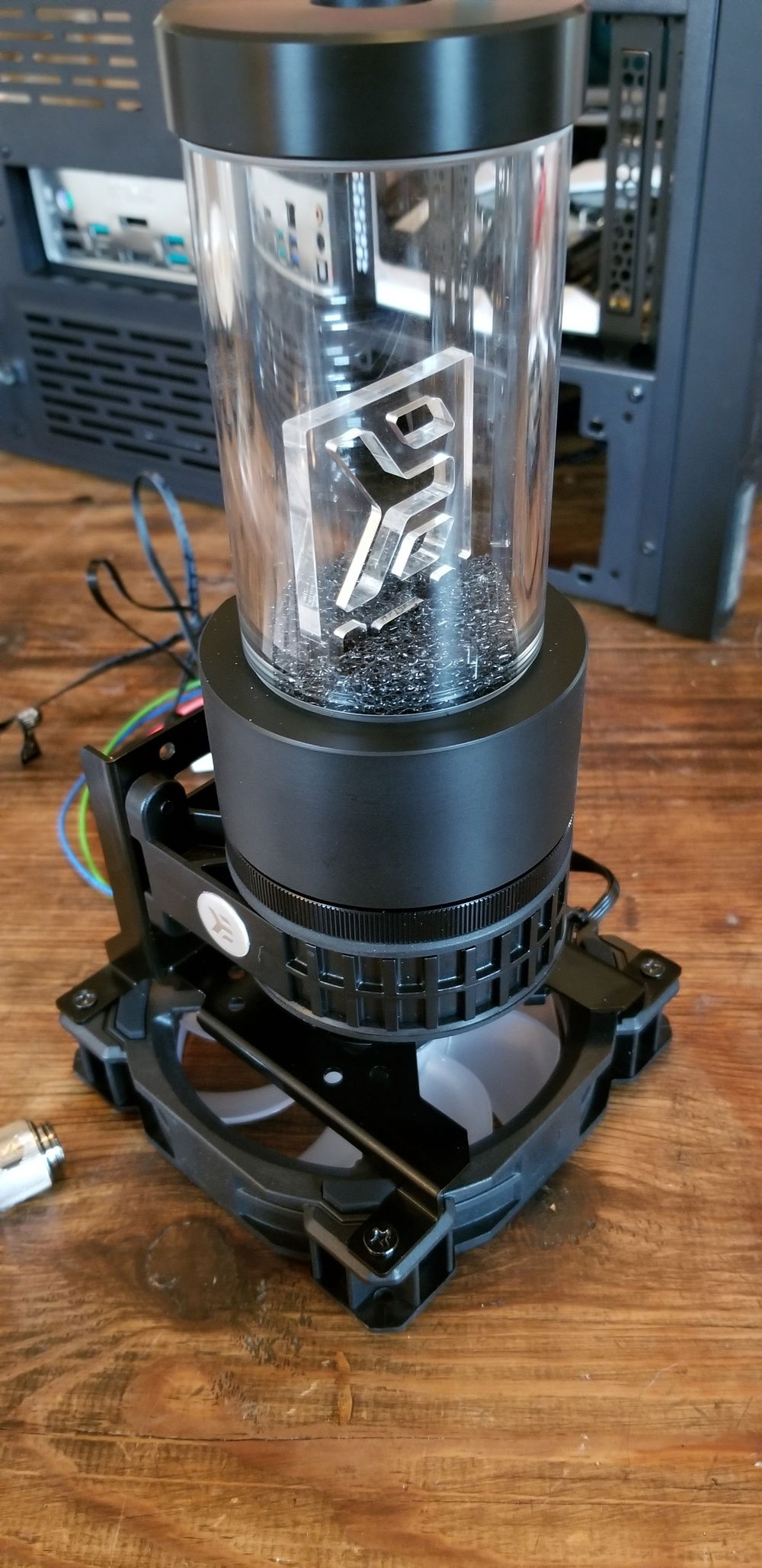 The angle to the inlet and outlet of the pump was challenging to align with the video card. While the LianLi case was large it was still a tight fit.