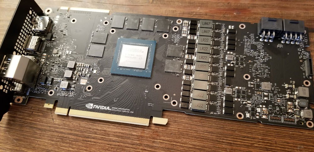 After the MASSIVE cooler is removed, it's hard to believe so much power lies within such a thin PCB ... little did I know those components to the left of the PCIe pins would make the later steps, STUPID challenging