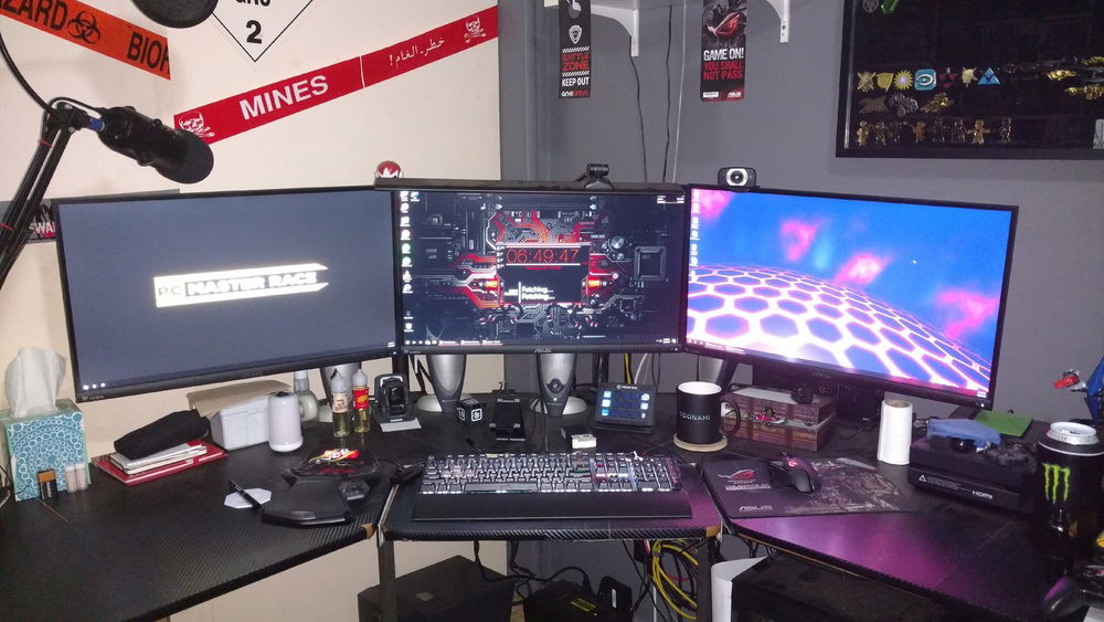 Triple-wide Asus monitors, with a Logitech and Blue Yeti for streaming. Right monitor is on an arm so I can turn it portrait if need be.