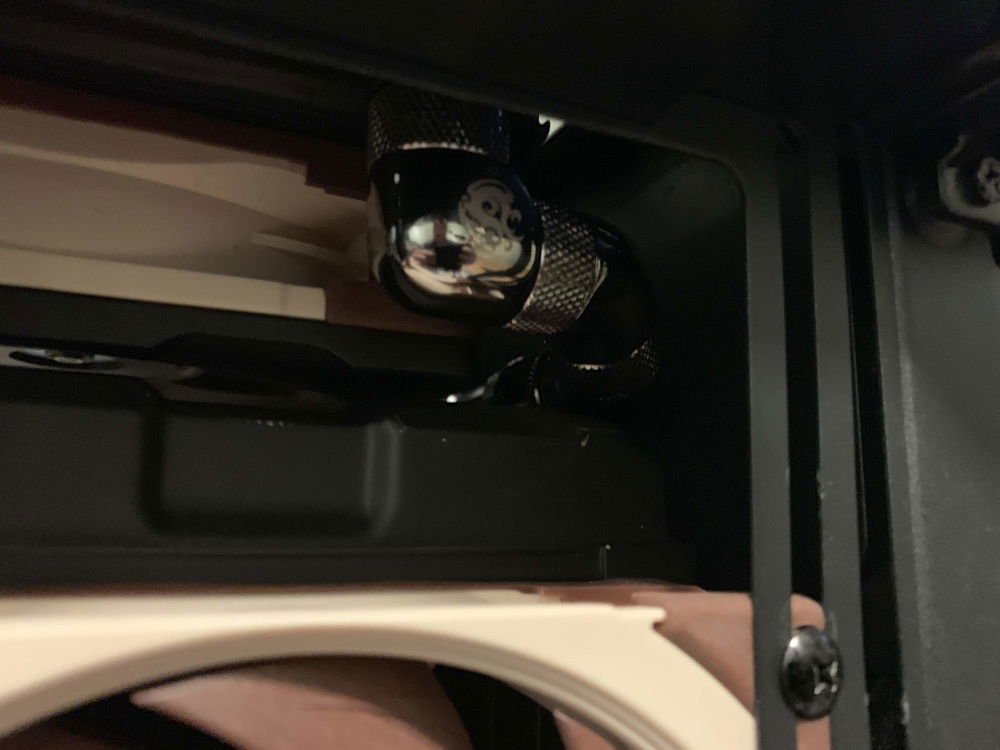 Front view of the fitting run from upper radiator to reservoir intake.