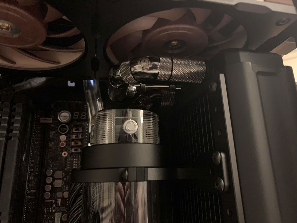 Side view of of the fitting run from upper radiator to reservoir intake.