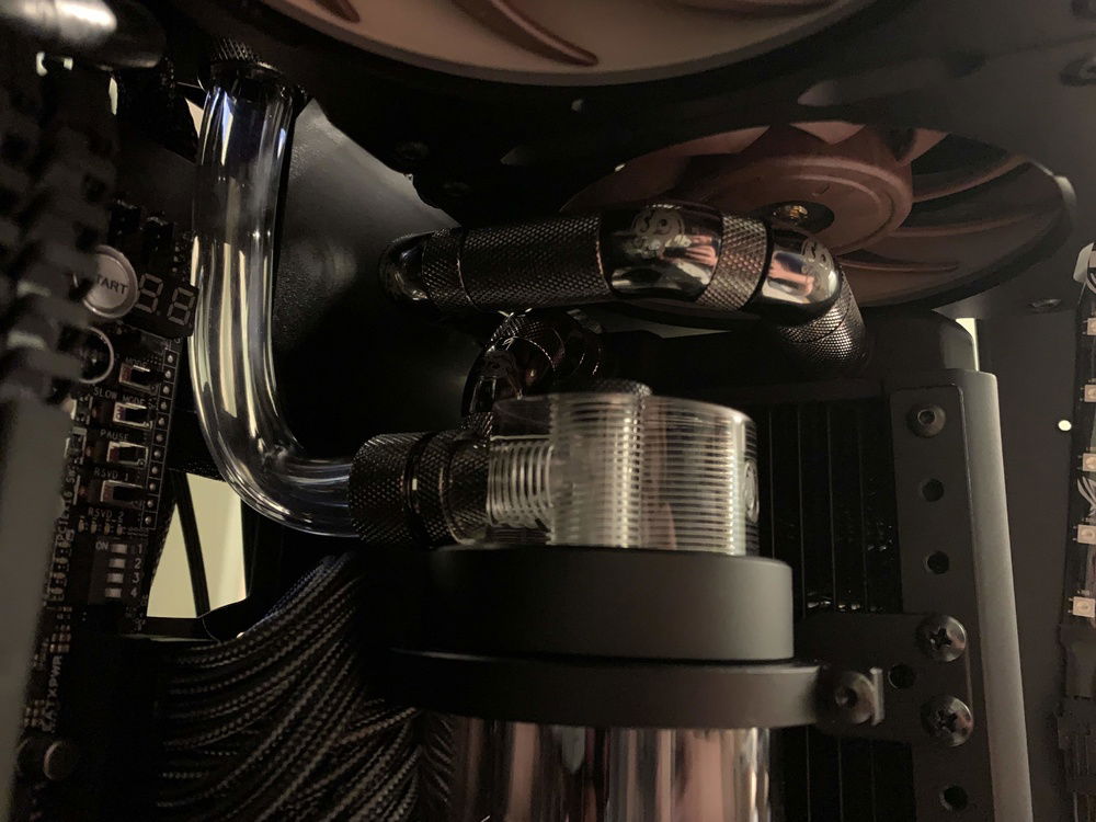 Rear view of the fitting run from upper radiator to reservoir intake.  The connection to the top fill port is also visible.