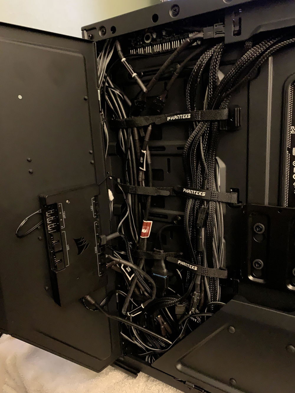 Commander Pro mounted to SSD mounting panel/cable management cover using foam mounting tape.  Note that I had to use a flat USB 3.0 internal extension cable to connect the front panel USB ports to the header on the motherboard due to the case blocking access to the rotated header on the Apex.