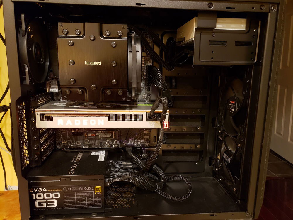 The internals of the beast. Cable management is "Meh" as the model of the dark base pro 600 I got doesn't have all the really nice wire grommets in the back of the case. Fixing in V3.