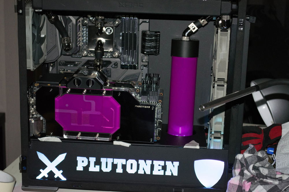 My camera makes the purple EK fluid look pink.
I had to white balance and colour correction so that why the purple varies in the pictures.
This is one of the most accurate pictures of the colours (no LEDs to screw up the colouring more).
Test fit and played around with vinyl and a razor on the bottom cover plate.