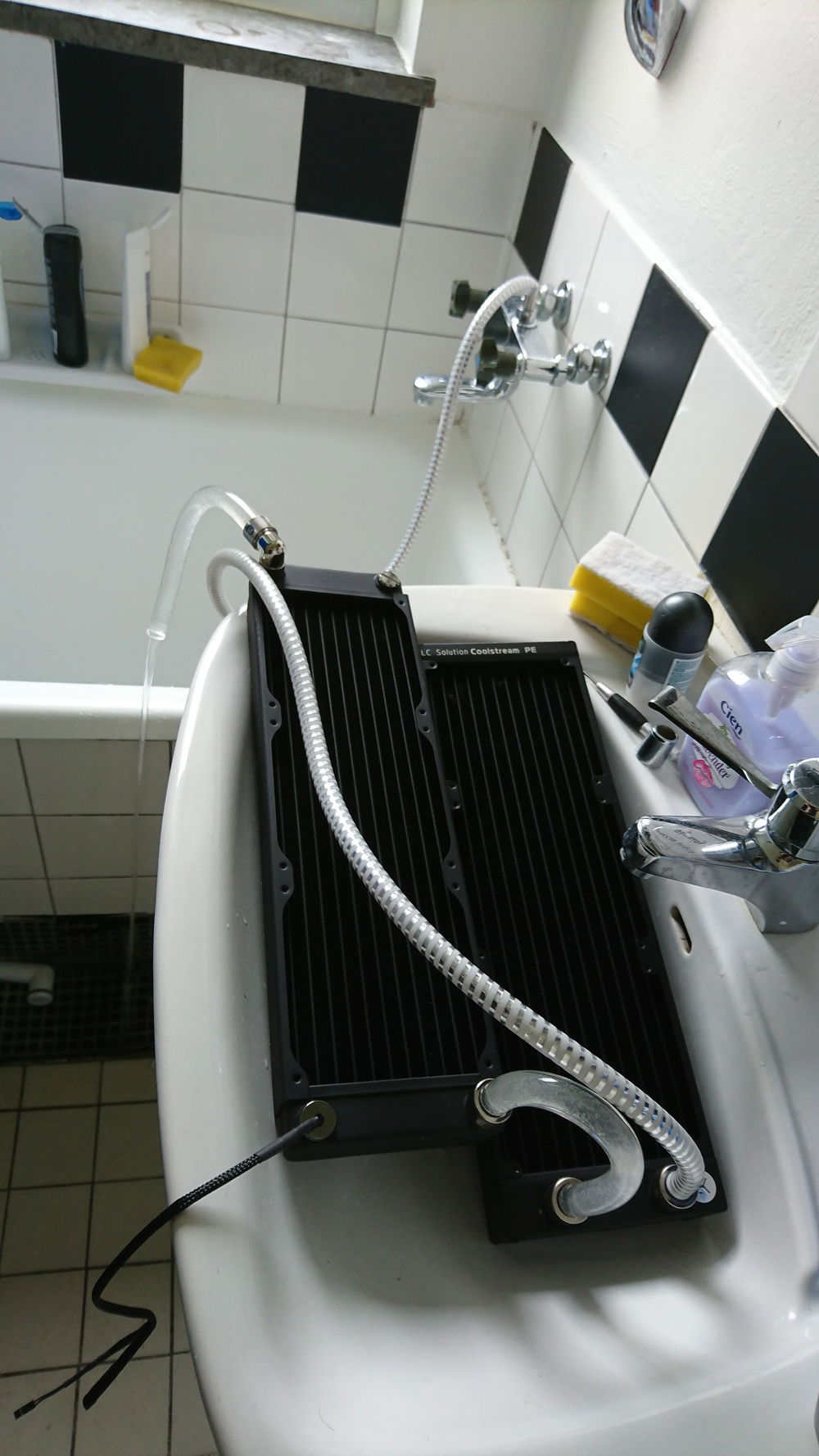 Flushing Radiators with alternating cold/warm water and then just doing a normal distilled water flush before install. First warm flush i did was into my bathtub and a thin oily film(flux?) was on the surface of the water.