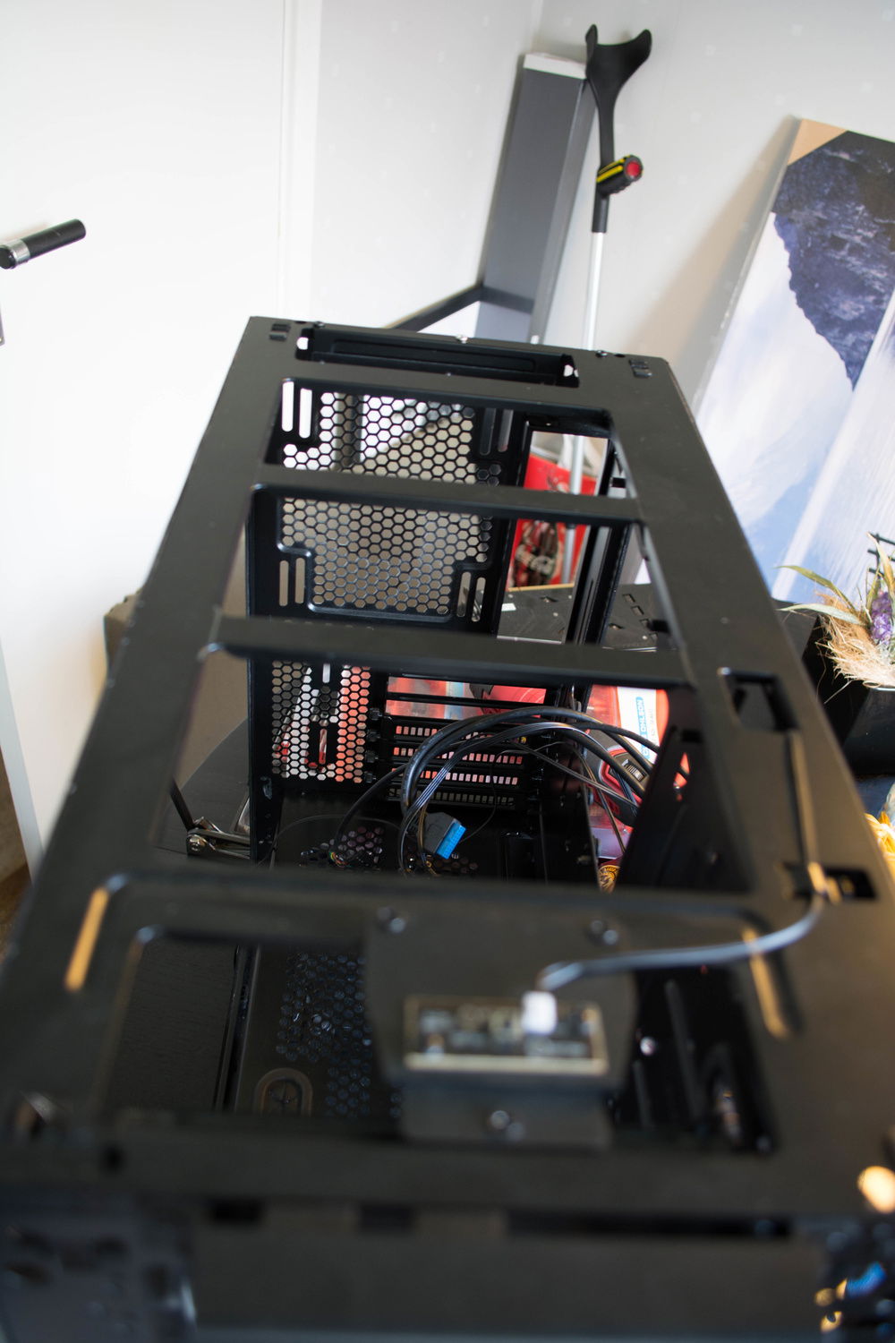 Metal braces in the way of mounting fans on top of radiator.