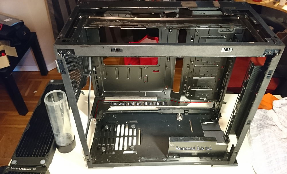 This is the most naked chassi photo as you can see it's missing the psu shroud and the remaining parts were removed later. The Radiators and the motherboard are now structural parts of the chassi.