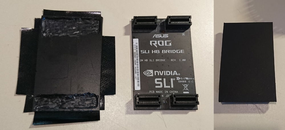 Plexiglass and a tiny bit of vinyl and the SLI bridge looks lovely. lightning makes it look crooked.