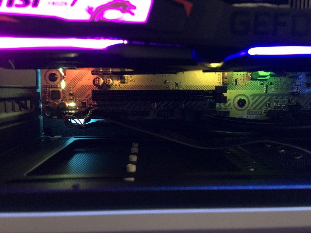 Underglow showing off the white PCB of the motherboard.