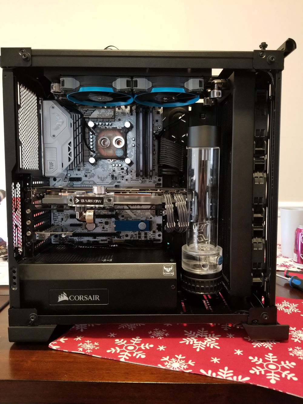 Figuring out where I need to drill mounting holes into the bottom of the case for the EK D5 pump mount/EK L-Brackets. As you can see between my 1080 Strix card and going me going with the EKWB PE360 Rad I had barely enough room to fit into my pump/res. After switching the SP120 fans in this picture with corsairs LL120s the rubber pads on the LLs actually brought the rad even closer to the res which made it quite hard to put the rad and new fans back in.