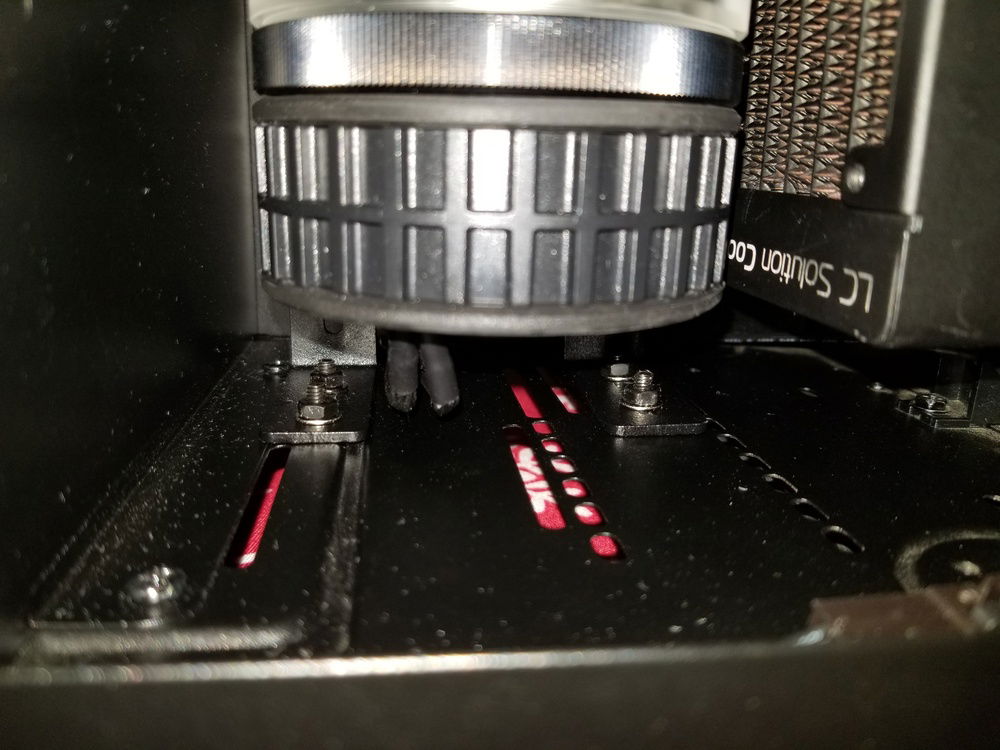 Pump/res mounted with EKs hardware. This is actually now adjusted down and much close to the bottom of the case for clearance issues with the top of the res and my Thermaltake sensor. In order to get this mounted I had to place the case on its side and prop the res up straight. Then using a long thin pair of pliers I held the nuts while inserting the screws from the bottom of the case. Next time I have the loop apart I will be permanently affixing the nuts onto the brackets so this is no longer a pain to mount.