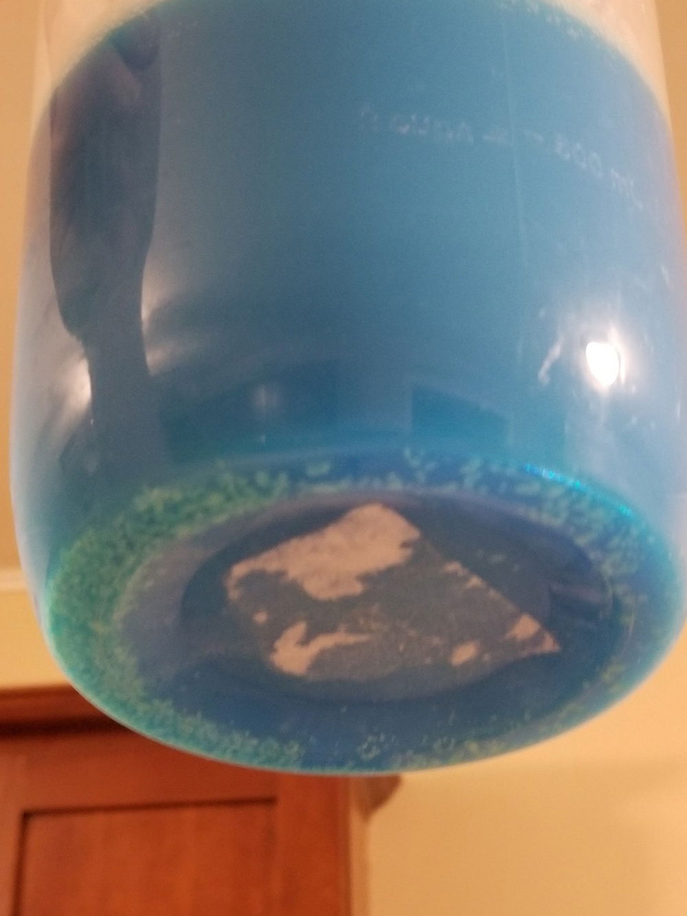 This is the issue I ran into with the EK Cryofuel Solid Azure Blue Concentrate which I have since found out others had been having the same problem. Unfortunately for me I mixed everything per directions while standing above my work surface and filled my EK squeeze bottle via a funnel with this mixture and began filling my loop before I found out there was an issue. As you can see there are varying sizes of chunks in this fluid.