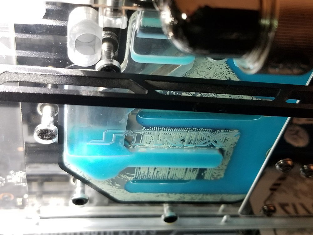 I finally receieved the RMA fluid which I noticed was from the exact same batch as the original fluid I got. I went ahead and mixed it and this time there was no chunks settling to the bottom, so everything looked good. I put my loop back together and did another leak test with distilled water for 4 hours. Then drained and filled loop with the new coolant. However after a while I noticed I again had severe build up in my gpu block as well as around where the d5 pump slides into and seals on the clear pump top I used.