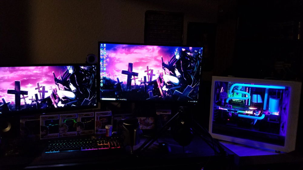 Little setup pic...needs to be cleaned up and cable managed, once I'm done I'll post more pics