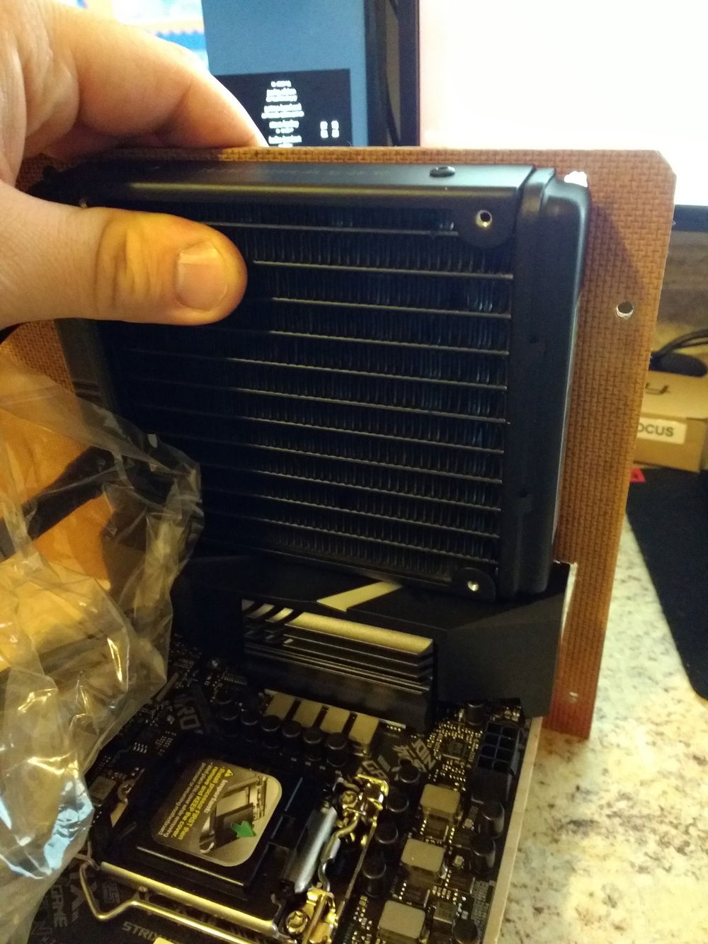 Originally I wanted to use this AIO liquid cooler, but it was about 1/4" too tall - I forgot to account for the motherboard risers!