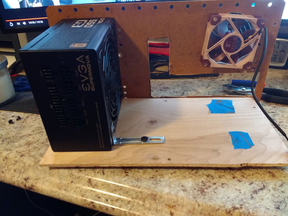 The power supply installed. That little bracket does most of the heavy lifting to keep it in place, and it also doubles as a way to ground the case.