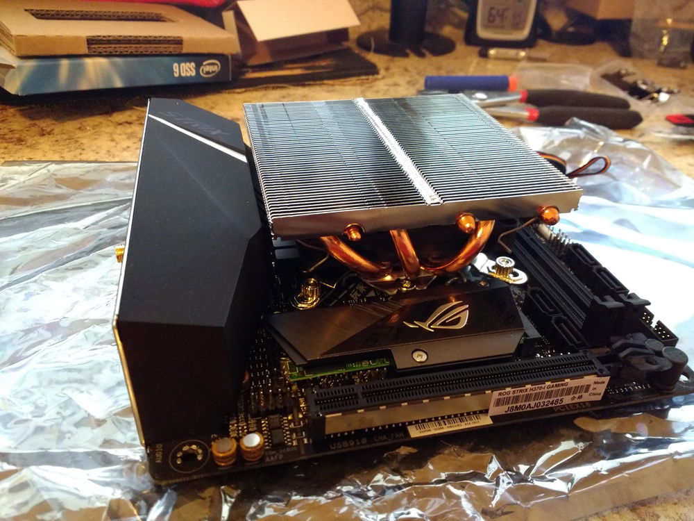 The motherboard/proc/cooler outside the case.