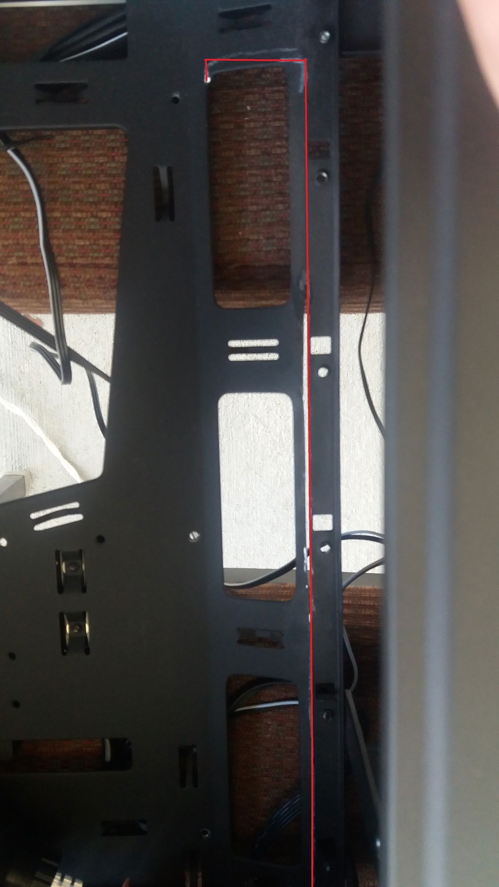 I had to cut on the red line to get the motherboard to fit.