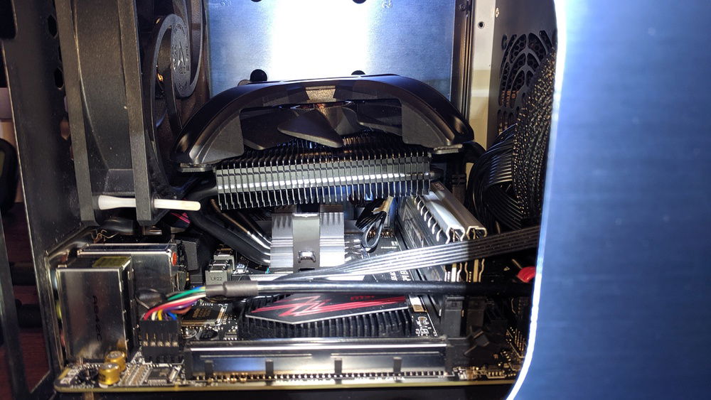 After receiving the cooler I ordered. I had to bend it up to sit over the RAM sticks.