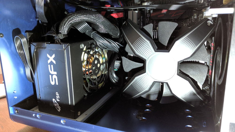 Removed the PSU fan because it sounded like a hair dryer, Artic Pressure Optimized rear intake fan keeps it cool.