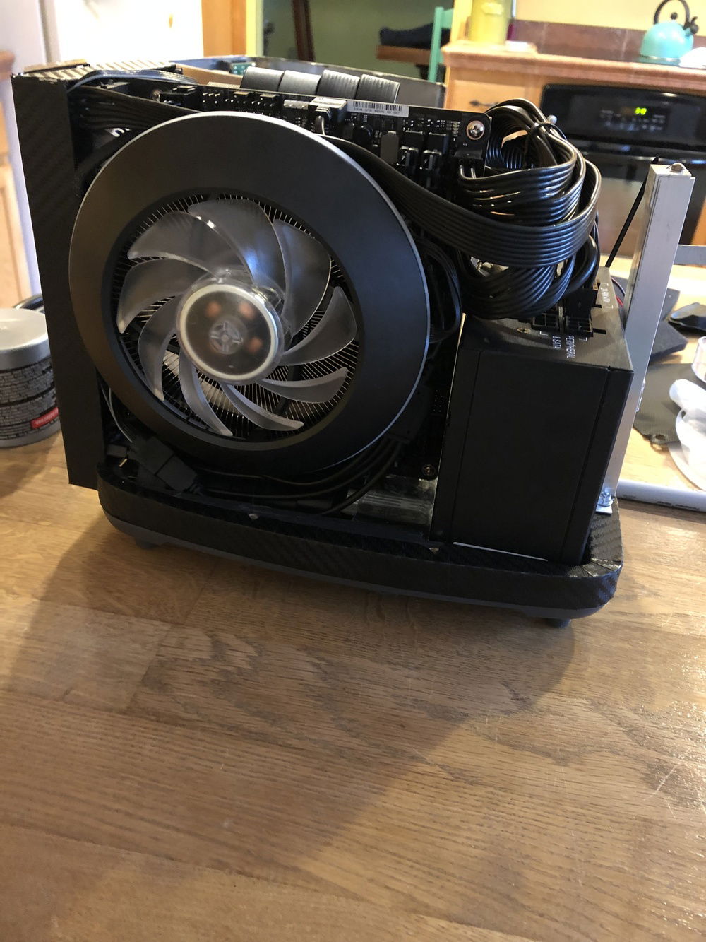 After cable management. The PSU uses a right angle power cable and routes out the bottom to the back, just like the original toaster did before I, uh, repurposed it.