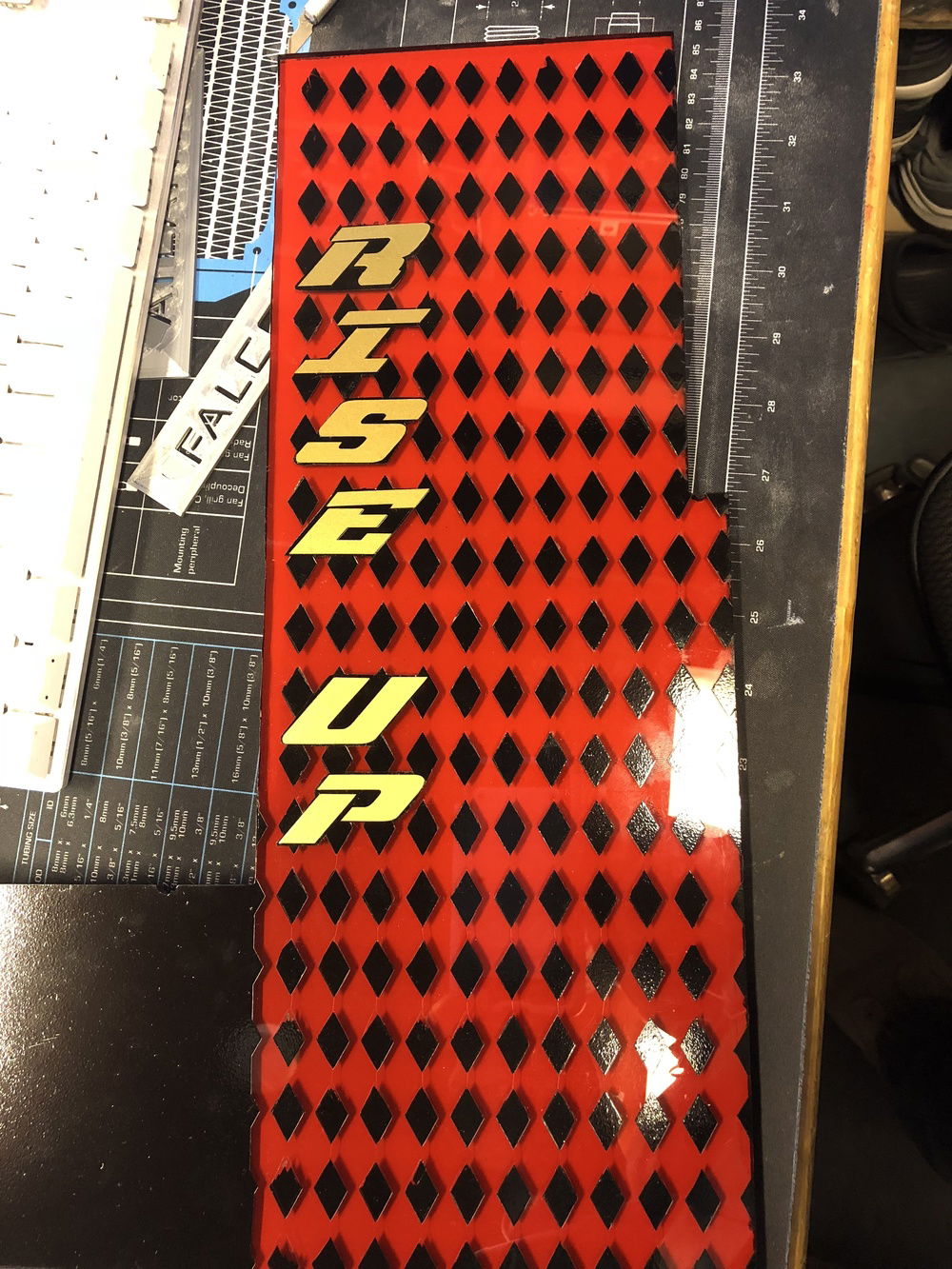 Gold lettering added on top of the black painted vinyl stencil