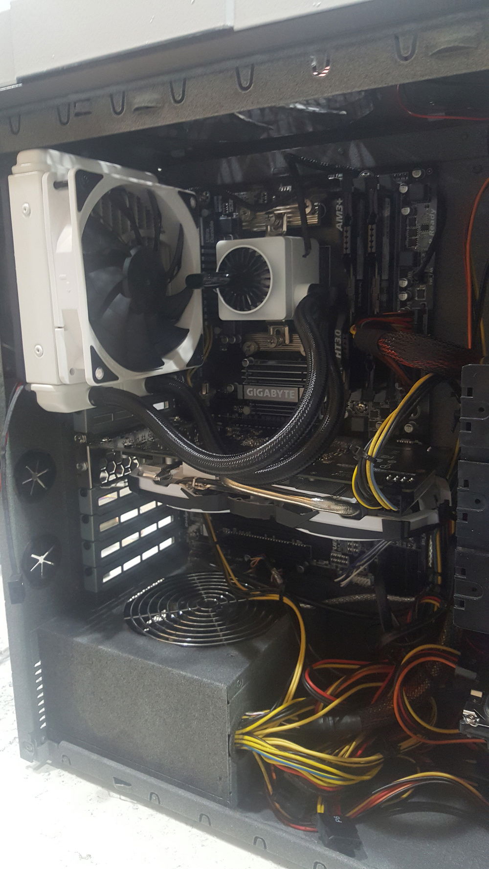 I spray painted the inside of the case/psu to remove that flat aluminum look. i also tried to keep the white and black theme flowing on the inside with the choice of GPU and AIO