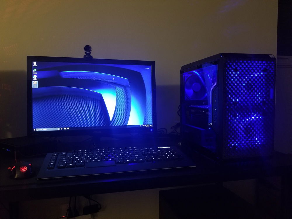 Shot of the workstation I used to set up the OS, showing the blue glow observed when lights are low and how the light of much the Rosewill fans gets through the magnetic filters of the Q300L. This is actually my fiancee's workstation, typically associated with the Arctic White build nowdays.