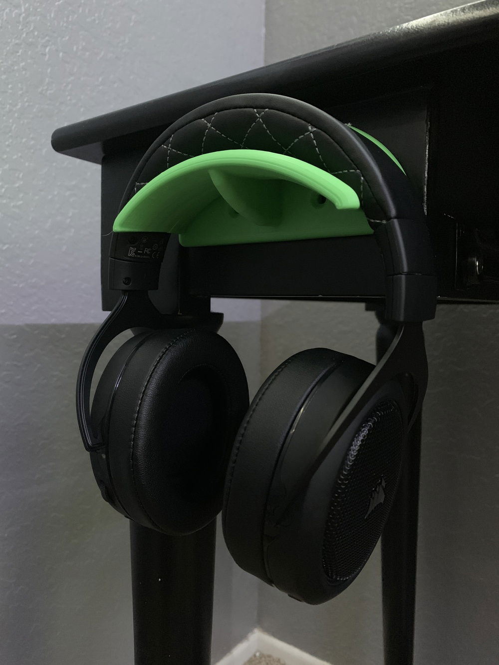 I have a custom 3D printed headphone holder that is attached to the front of my desk