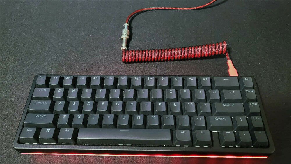 My custom Drop Alt keyboard, absolutely love this thing. High profile version, Drop Skylight series black keycaps, Glorious Panda switches filmed and lubed with G-Lube. Also swapped out the basic stock USB cable for a custom red coiled aviator cable.