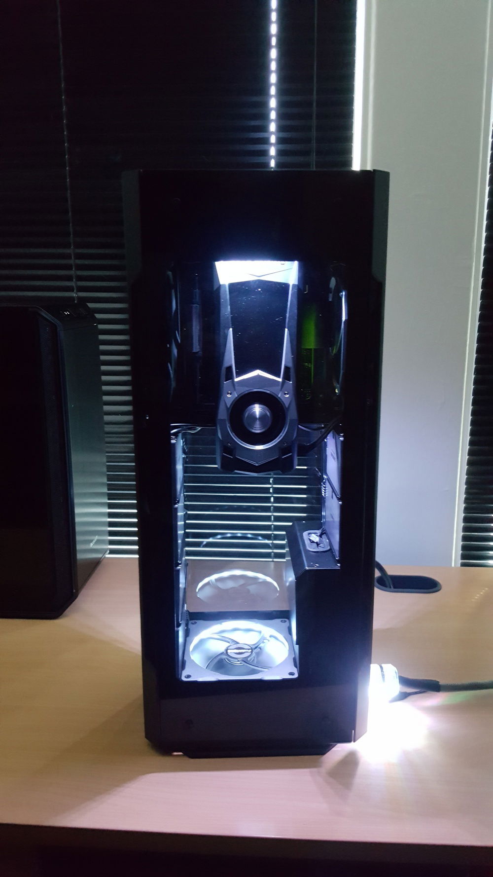 The GPU is mounted onto a modified mounting bracket that has a much cleaner appearance (no bracket exposed on the left side of the GPU).