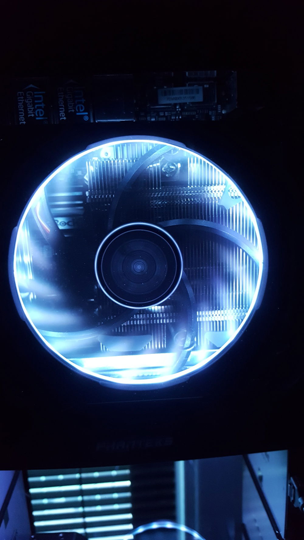 ProlimaTech 120mm slim-profile cooling fan and low profile Noctua rad cool the CPU.