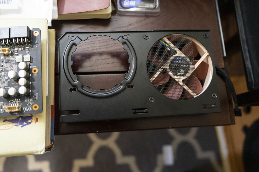 Added a screen the G12 bracket to keep heatsinks from falling into the fan just in case the adhesive doesn't hold