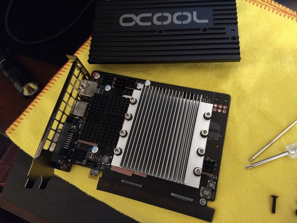 1050 3GB GPU with heatsinks attached, an Alphacool GPX backplate was used to help transfer some heat away.
