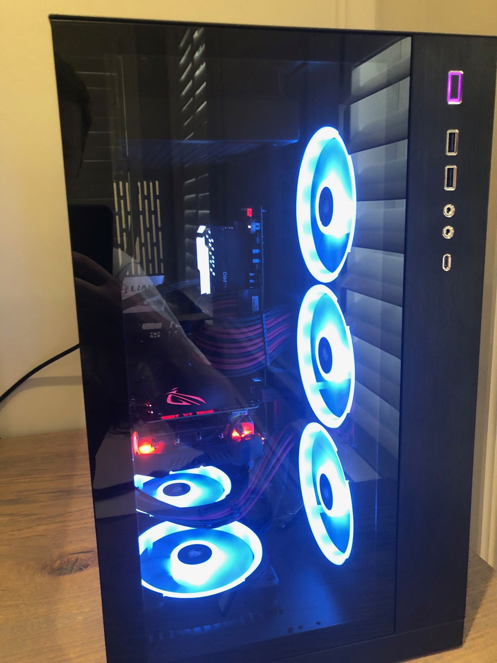 Fans on the top of the H150 pulling air into the case the other six LL fans exhausting.  I know this isn't the most efficient setup for cooling but aesthetically it was the one I liked the best.  Will eventually put the whole thing in a custom loop anyways.