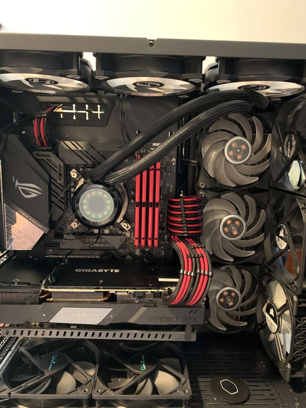 Moved AIO hoses up so I can add RGB ram. And new Red and black Cables for the 24 pin and 8 pin top left