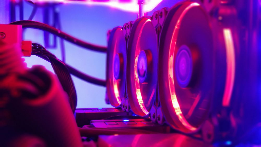 Thermaltake Water 3.0 Riing RGB 360 hanging from side post in untraditional mounting for better thermals and cleaning capabilities