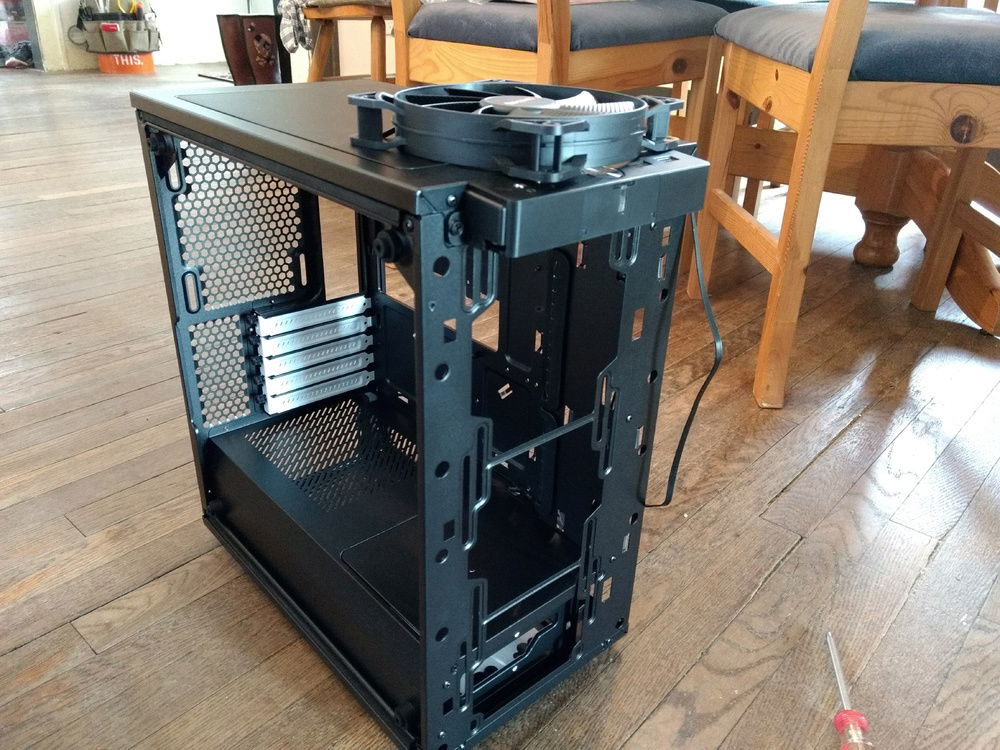 The Fractal Design Define Mini C TG Stripped down. It came with fans, which were quickly pulled for being White.
