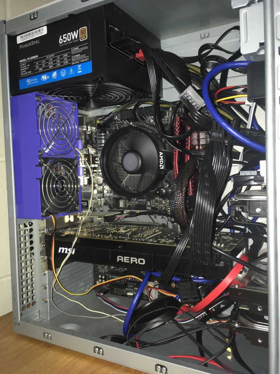 Behold the guts of my mighty machine! It's gotten more crowded and much has changed, but the cable management is as beautiful as it ever was!