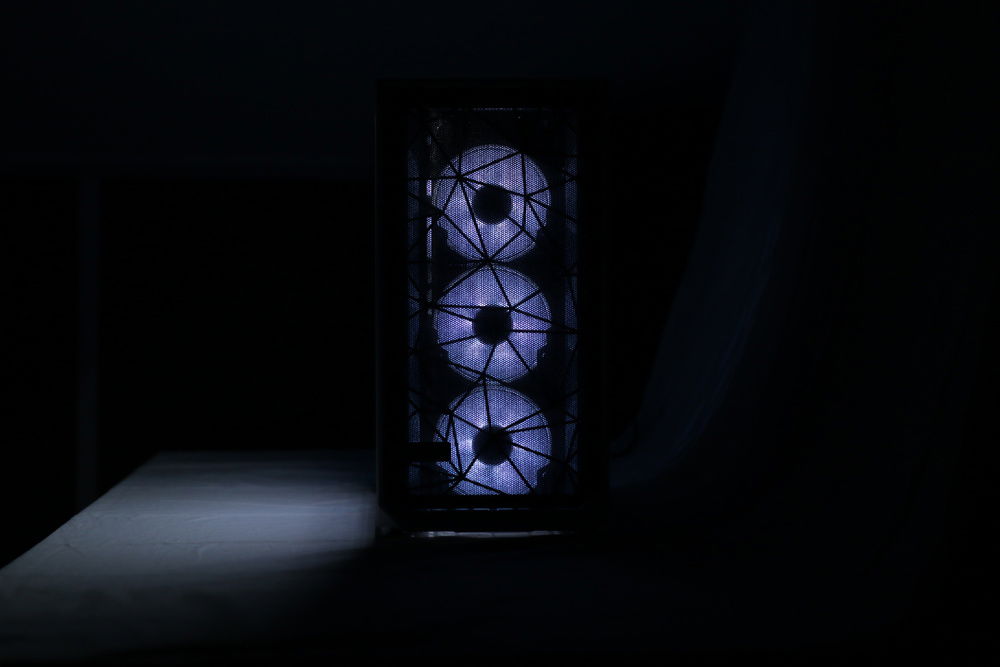 The triple Fractal Design Prisma AL-12 fans shining through the Meshify S2 mesh front.