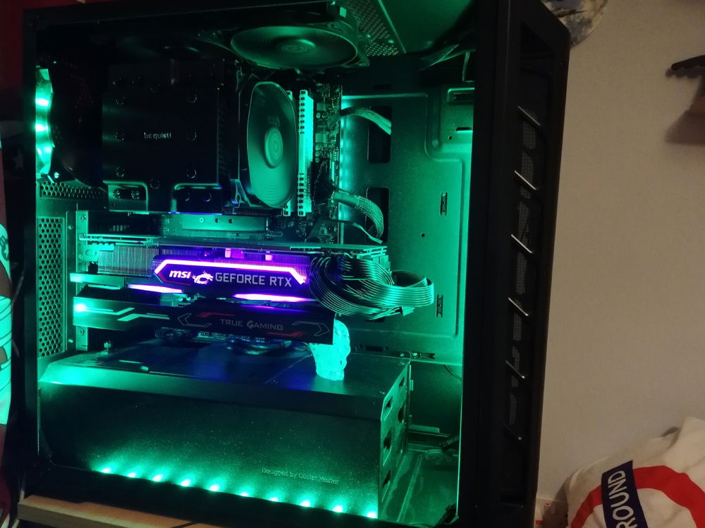 New GPU installed, with its' sag bracket, and a glass skull I bought on holiday.