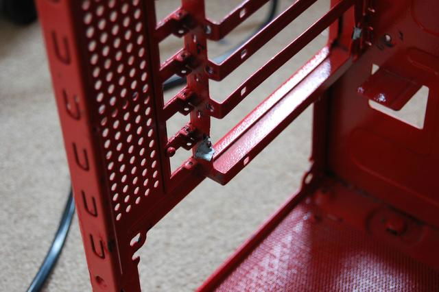 PCI bracket divider had been torn out, perhaps for external watercooling by the previous owner.