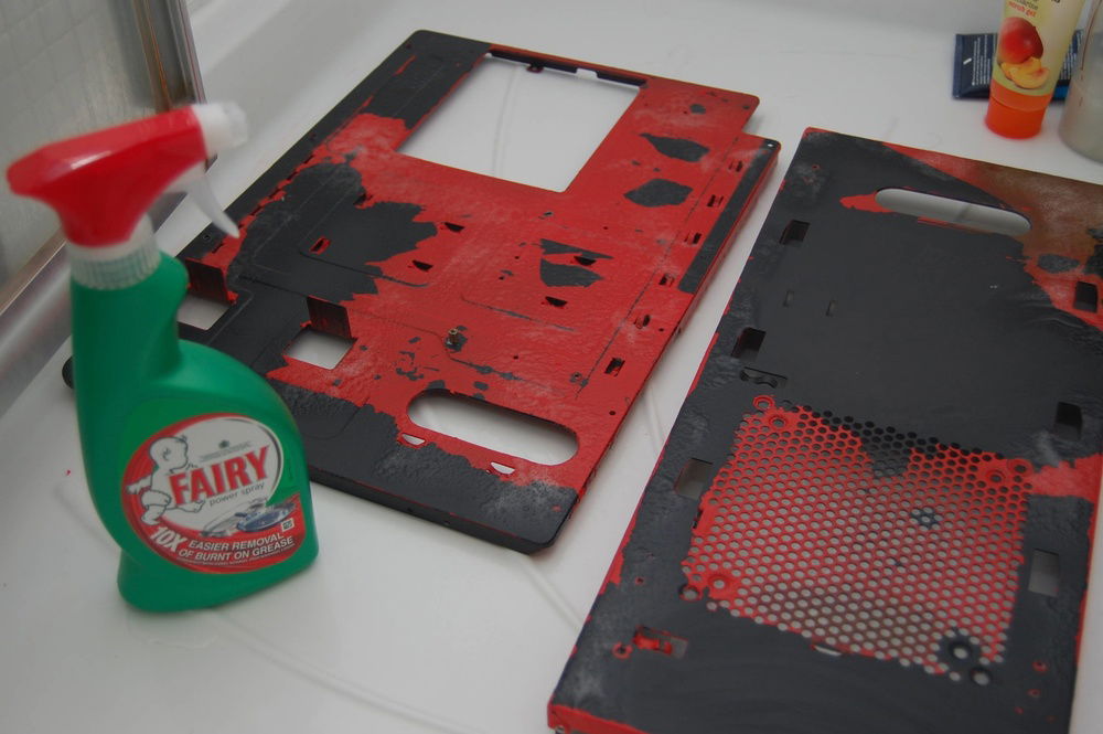 Using Fairy Power Spray to soften and scrape off the paint.  The factory powder coat was still intact underneath.