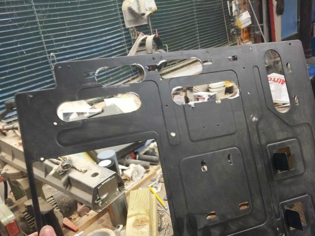 Cut some holes in the motherboard tray for improved cable management.