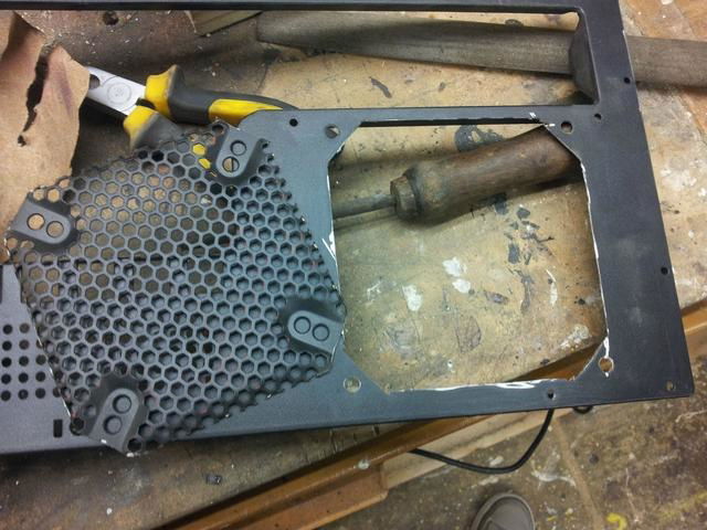 Removed the rear mesh too.  This was replaced with a wire fan grill.