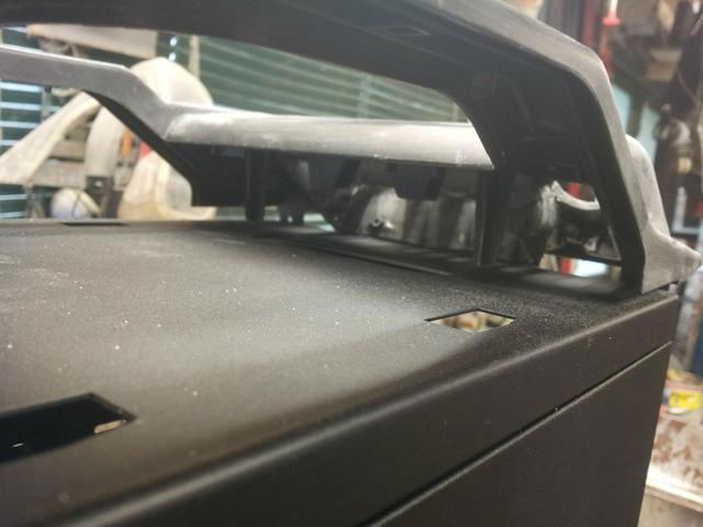 Cutting some metal away to allow clearance for the fan controller.