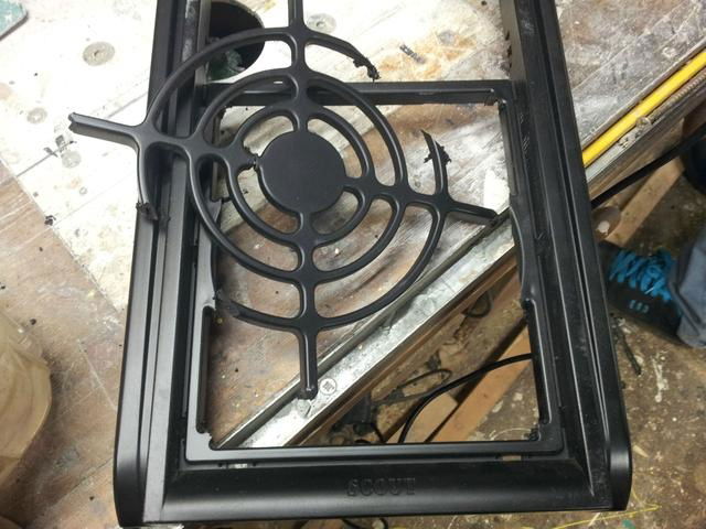 Removing even more factory fan grille material.