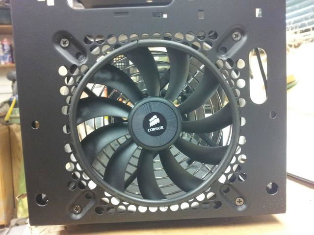 Corsair AF140 fan installed in the front and top of the case.  Rubber U-channel installed to neaten up the edges.