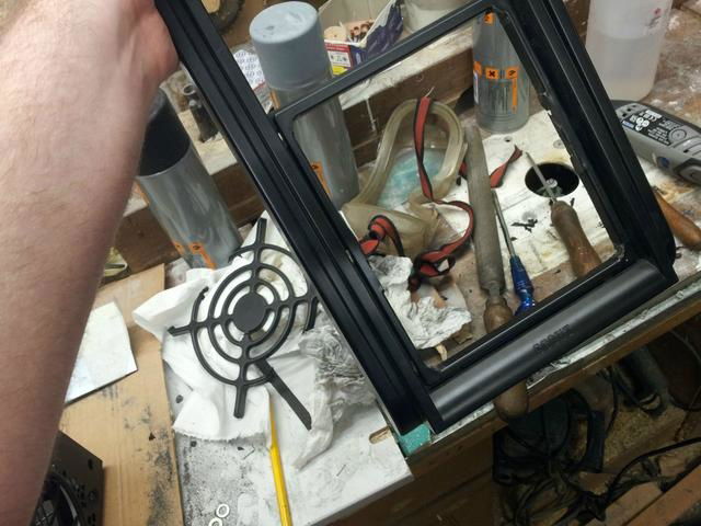 Removing even more factory fan grille material.